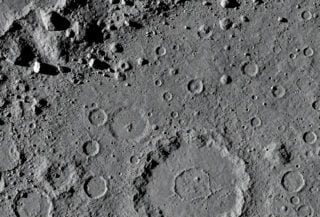 High-resolution lunar surface detail showing craters and rocky terrain from orbital mapping