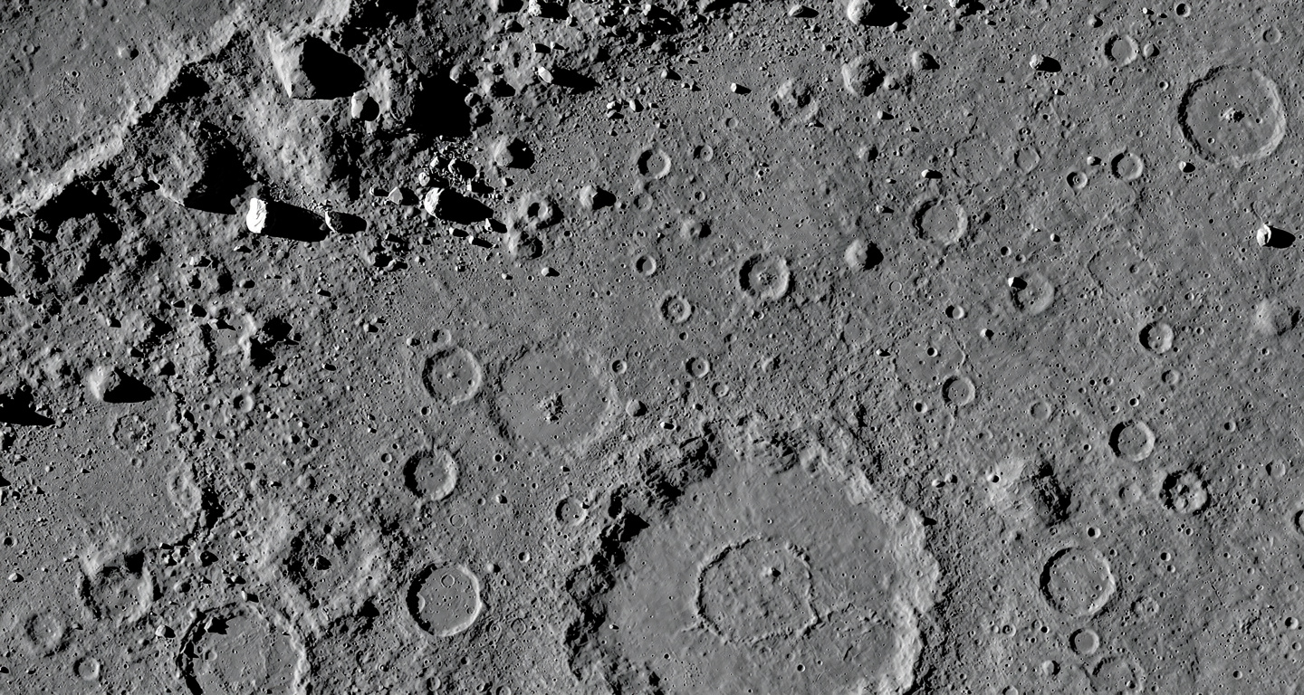 High-resolution lunar surface detail showing craters and rocky terrain from orbital mapping