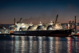 LNG tanker at industrial port terminal, Texas Gulf Coast at dusk