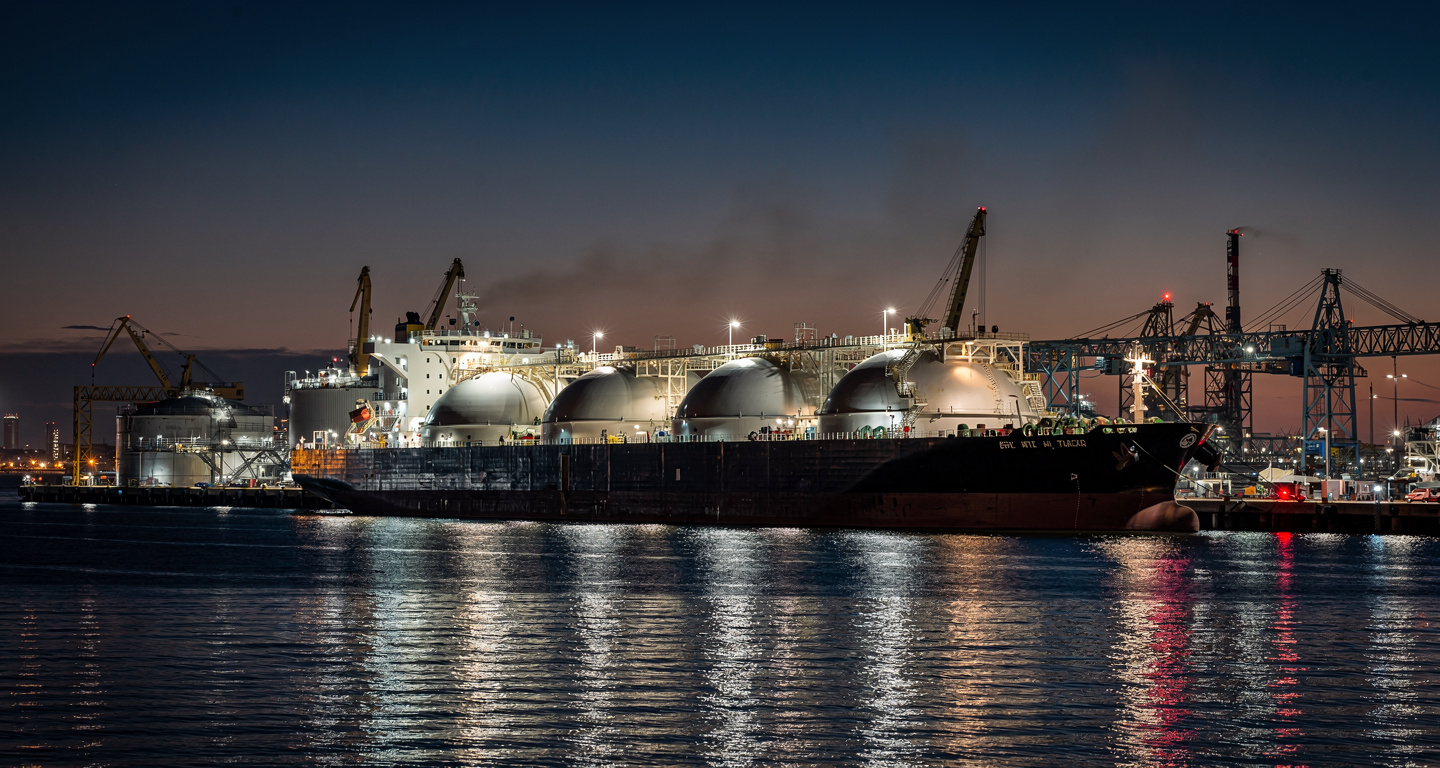 LNG tanker at industrial port terminal, Texas Gulf Coast at dusk