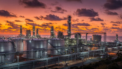 Oil refinery and storage tanks at dusk, Australia