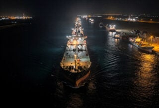 Oil tankers queued in Strait of Hormuz at night, Persian Gulf maritime chokepoint