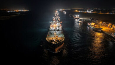 Oil tankers queued in Strait of Hormuz at night, Persian Gulf maritime chokepoint