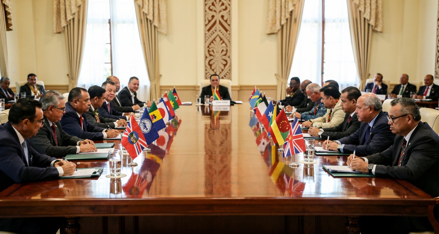 Pacific Island leaders at regional summit meeting, formal diplomatic setting with national flags