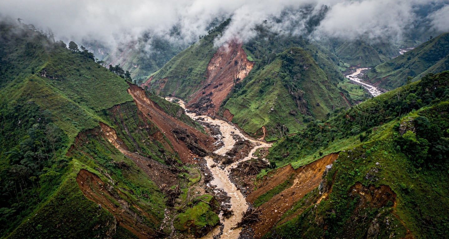 Saturated mountain slopes in Lai Chau province, northern Vietnam, showing landslide damage and debris flows