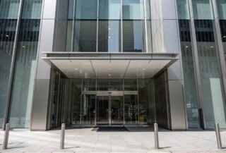 Tokyo business district office building with modern glass entrance