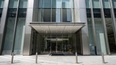 Tokyo business district office building with modern glass entrance