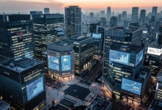 Tokyo financial district with cryptocurrency tax rate displays on digital screens
