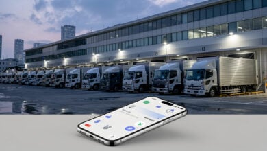 Tokyo logistics distribution center with delivery trucks and digital payment interface
