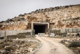 Underground tunnel entrance in limestone hillside, southern Lebanon