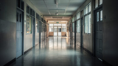 Empty school hallway with closed doors, morning light, Bangkok institutional setting