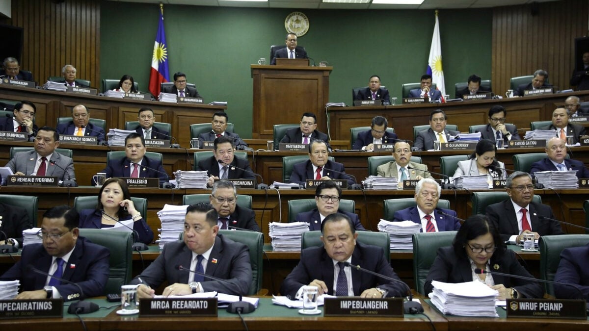 Philippine senators in formal session during impeachment hearing, Senate chamber, fluorescent lighting