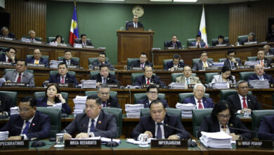 Philippine senators in formal session during impeachment hearing, Senate chamber, fluorescent lighting