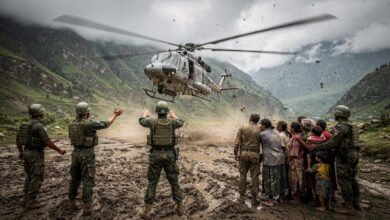 Rescue helicopter landing near Bidur with military personnel and waiting families in Himalayan valley