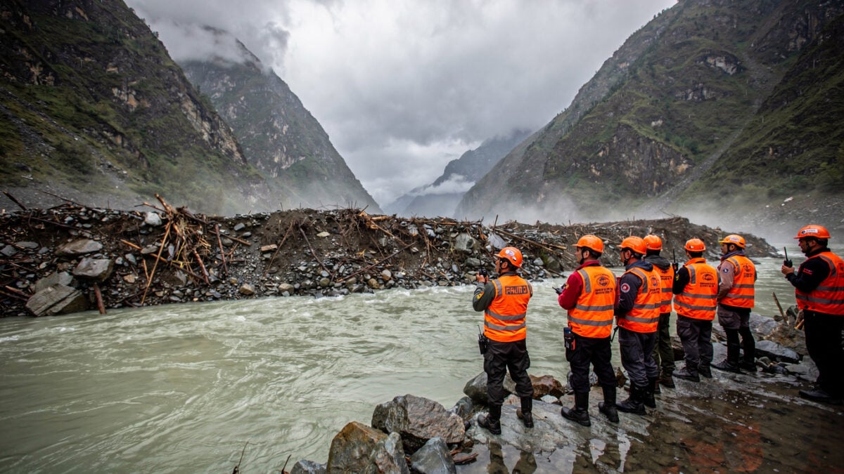 Rescue workers at debris-dammed barrier lake in Nepal-Tibet border Himalayan valley, monsoon conditions
