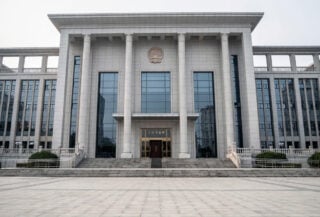Shenzhen Intermediate People's Court building exterior, formal judicial architecture, overcast light