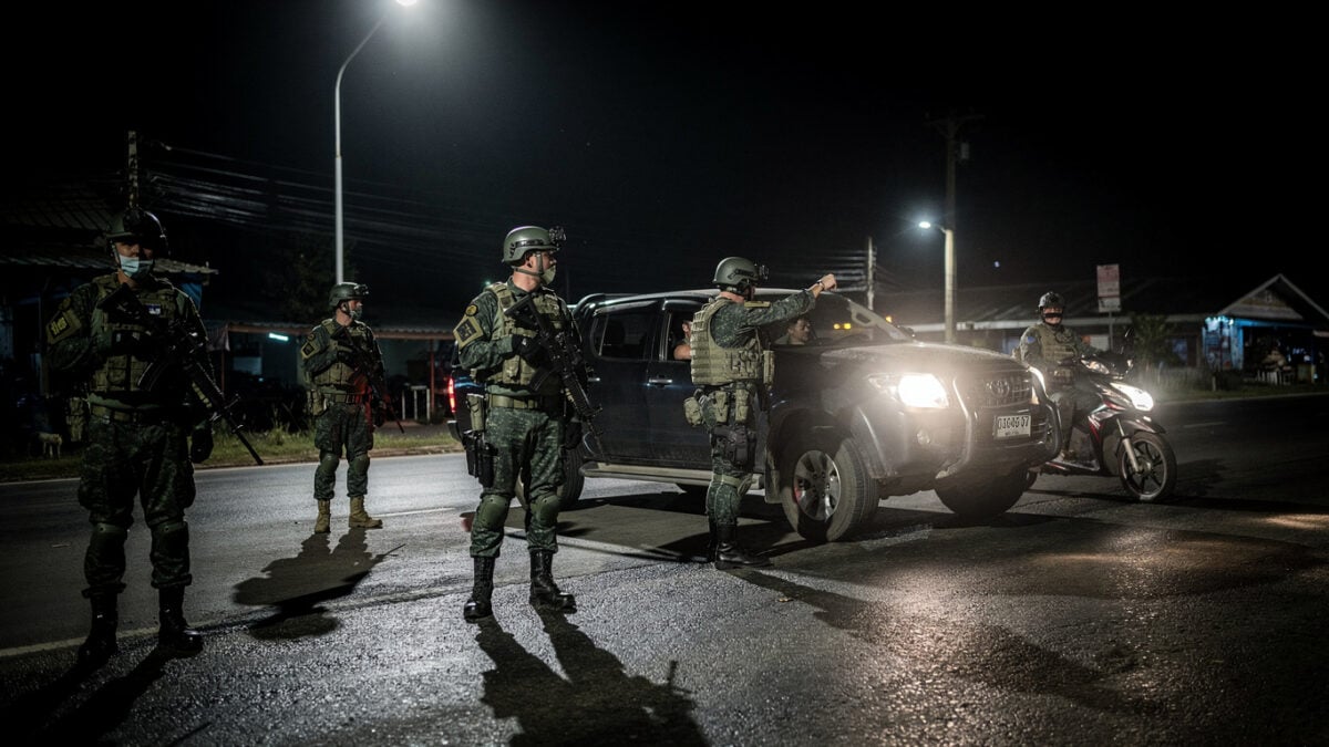 Thai soldiers manning nighttime checkpoint in Narathiwat after coordinated attacks