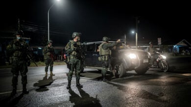 Thai soldiers manning nighttime checkpoint in Narathiwat after coordinated attacks