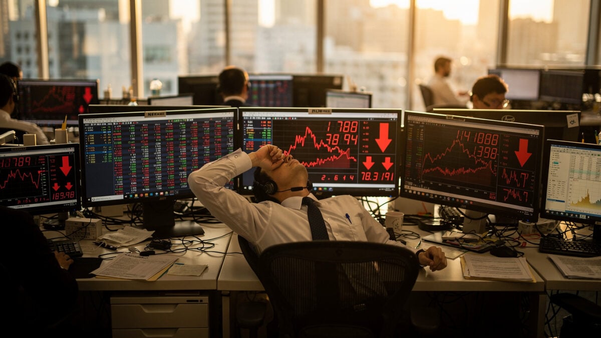 Tokyo traders monitoring red market indices on screens as yen strengthens, dealing room afternoon light
