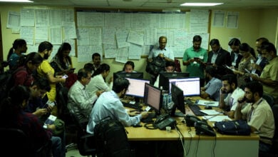 Indian consular staff and travellers in crowded Riyadh control room
